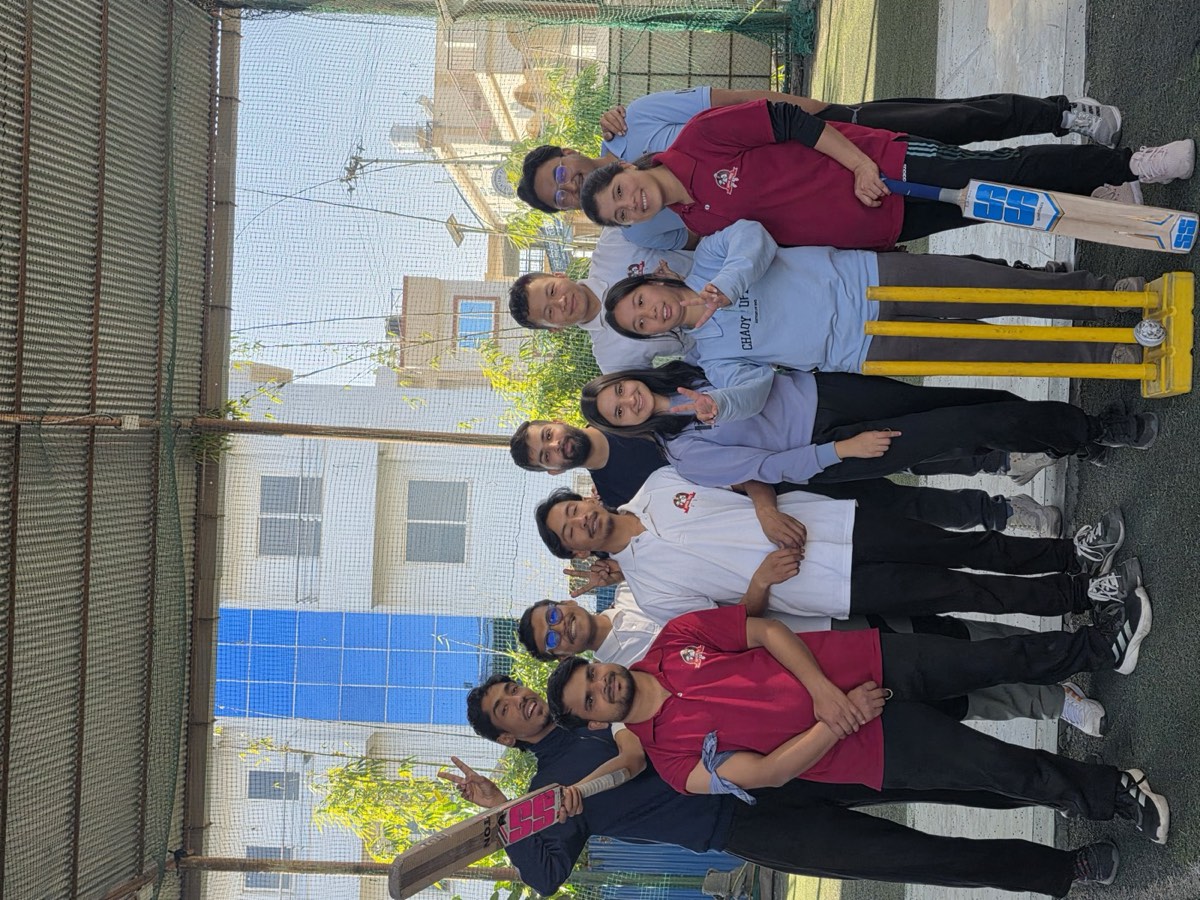The VanarX team with bat and stumps on cricket day