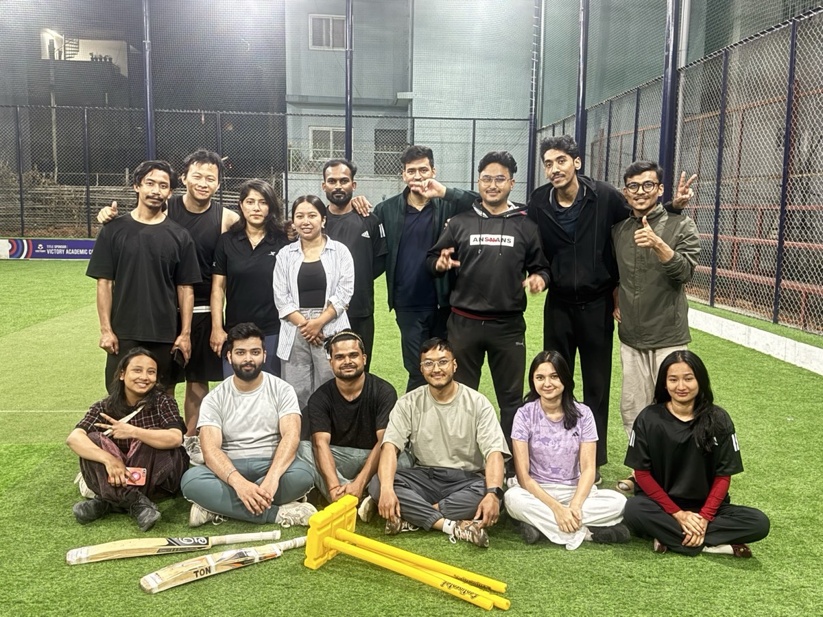 The VanarX team together on the cricket turf at night