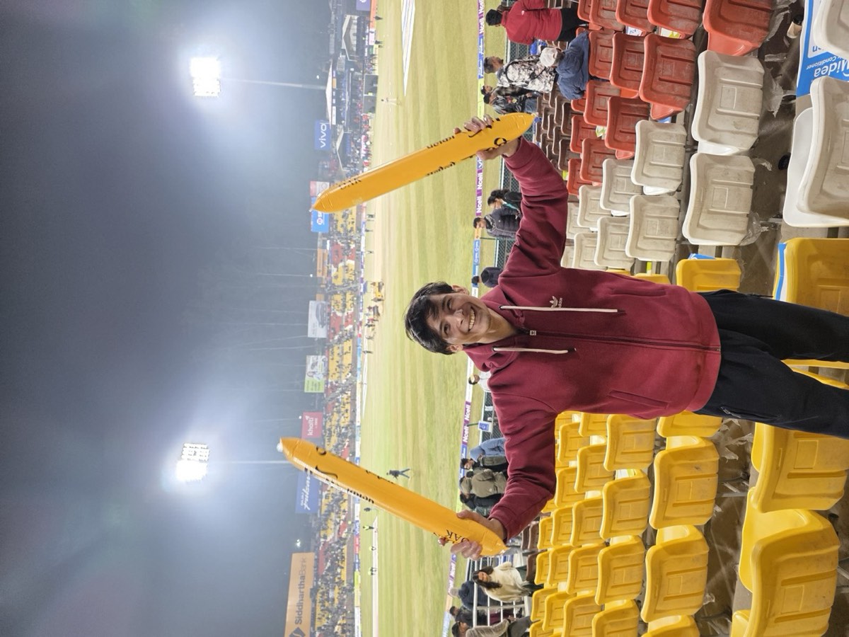 A team member cheering at the stadium