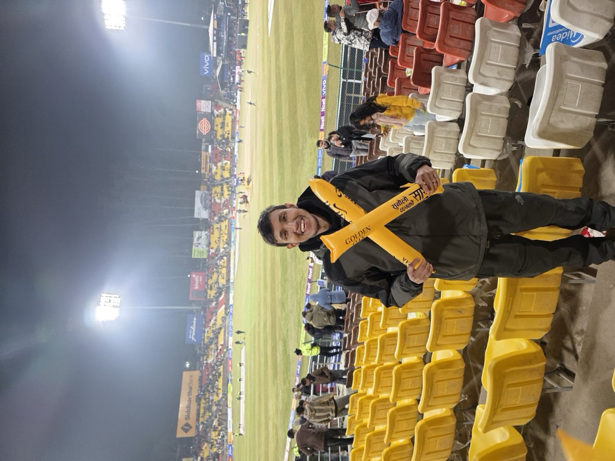 A team member with a cheer stick